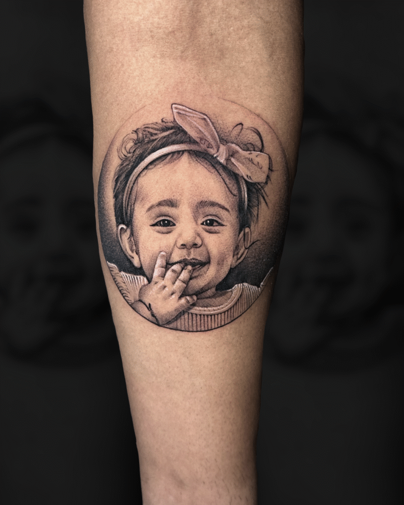 Realistic portrait tattoo design on arm